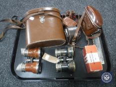 A tray of cased Linderman 10 x 50 binoculars, cased Diax Ib camera with accessories, mouth organ,