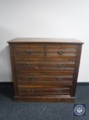 A late Victorian oak five drawer chest
