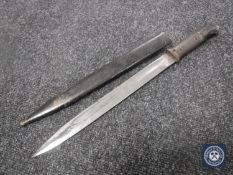 A German bayonet in sheath CONDITION REPORT: The blade is stamped BK.