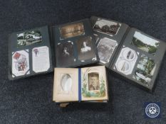 A Victorian leather bound photograph album and two albums of Victorian and later postcards