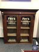 A Victorian mahogany bookcase top with later Fry's Chocolate advertising,