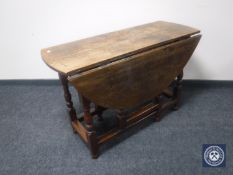 A Victorian oak gate leg table