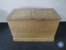 An antique stripped pine storage box