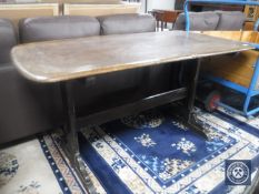 An Ercol elm refectory dining table