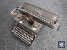 A vintage Imperial typewriter with cover
