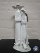 A Lladro figure of two nuns, number 4611,