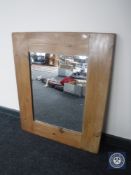 A contemporary pine framed mirror