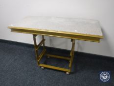 A marble topped side table on a gilt metal base