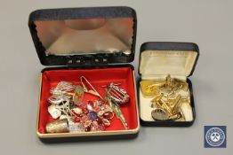 A box containing pair of silver cufflinks, gilt cufflinks, brooch,