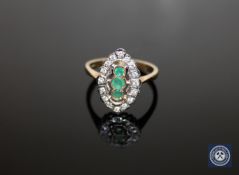 A 9ct gold emerald and diamond cluster ring,