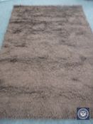 A hand knotted shaggy chocolate brown rug, 180 cm x 270 cm, rrp £681.