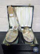 A pair of cased EPNS brushes,