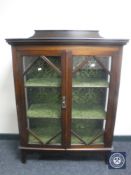 A Victorian mahogany double door display cabinet