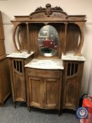 A late Victorian oak mirror-backed marble top sideboard,
