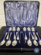 A set of twelve cased silver teaspoons with sugar tongs by Mappin & Webb