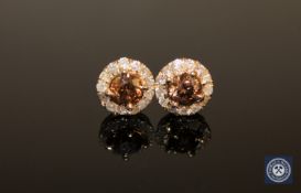 A pair of 14ct yellow gold diamond halo earrings, the two brilliant-cut,