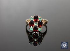 A 9ct gold emerald and garnet cluster ring,