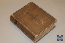 A leather-bound Self-Interpreting Bible by The Reverend John Brown