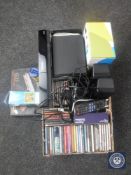 A box of Panasonic surround sound system, assorted CD's, projector,