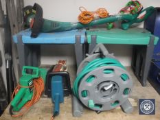 A hose pipe on reel, four garden kneelers,
