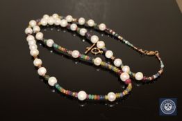 A cultured pearl, emerald, ruby and sapphire bead necklace, with gold clasp,