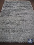 A hand knotted shaggy light blue rug, 180 cm x 270 cm, rrp £681.