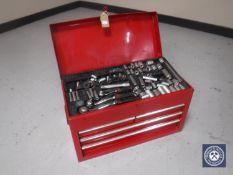 A metal mechanics tool chest containing socket sets and hand tools