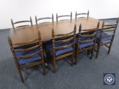 A ten piece oak dining room suite comprising of four door low sideboard,