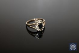 A 9ct gold sapphire and diamond cluster ring,