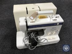 A cased Imperial Compal Ace electric sewing machine with foot pedal