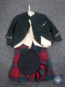 An early 20th century child's kilt together with two jackets,