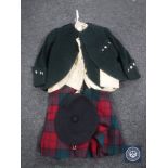 An early 20th century child's kilt together with two jackets,