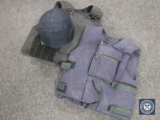 Two body armour vests together with a helmet