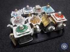 A tray containing nine Sadler collector's teapots