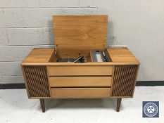 A mid 20th century teak cased Bush radiogram with Garrard turntable CONDITION REPORT: