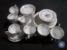 A tray containing a thirty-eight piece floral bone china tea service