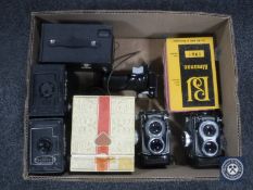 A box containing two Rollei T cameras together with a Rollei Magic camera,