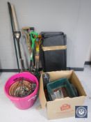 A quantity of garden tools together with s set of metal shelving (dismantled) and a quantity of