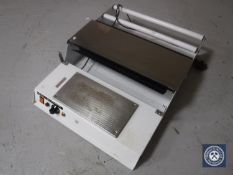 An electric catering cling film wrapping machine