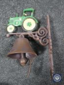 A cast metal tractor wall bracket with bell