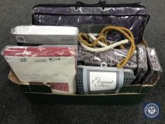 Two boxes containing a Christie bed throw with matching duvet set and pillow cases,