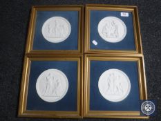 Four gilt framed Royal Copenhagen relief plaques