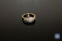 A 9ct gold diamond cluster ring, stated total diamond weight 0.