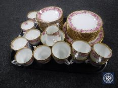 A tray containing a forty piece antique Royal Doulton china tea service decorated with pink roses