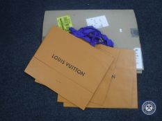 Nine Louis Vuitton retail bags together with two reams of tissue paper