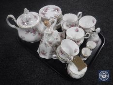 A tray containing twenty-five pieces of Royal Albert Lavender Rose tea china together with a Royal