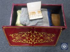 A hand-painted blanket chest containing woollen blankets, throw,