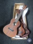 Two ukuleles; one labelled Lanikai, soprano with cover,