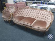 A continental mahogany framed salon settee and armchair upholstered in a pink buttoned dralon