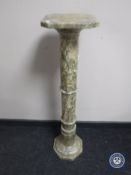 A marble torchere